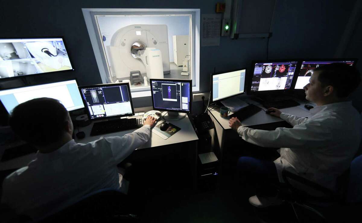 A patient undergoes a positron emission tomography scan for cancer at the PET Technology Centre in Ivanovo, Russia.