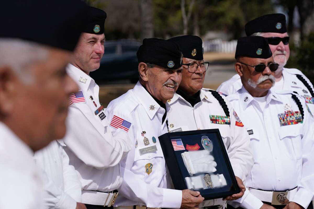 Rick Davila, 82, of the Fort Sam Houston National Cemetery Memorial Services Detachment smiles while being honored for 30 years of service during ceremonies Tuesday at the cemetery’s Assembly Area.
