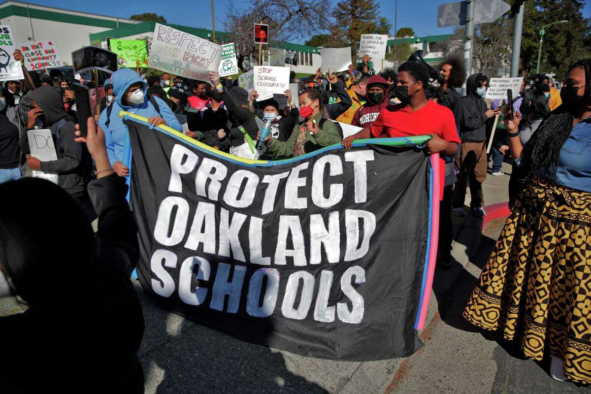 Students, teachers and parents walk out of Westlake Middle School before marching to Oakland Unified School District offices to protest its closure plan on Feb. 1.