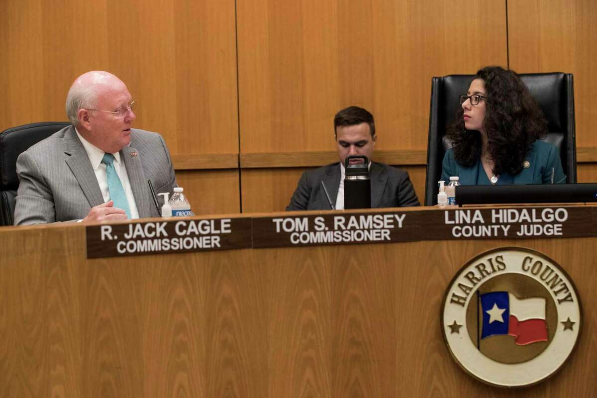 County Commissioner Tom Ramsey speaks to Judge Lina Hidalgo during Harris County Commissioners Court Tuesday, July 20, 2021 in Houston.