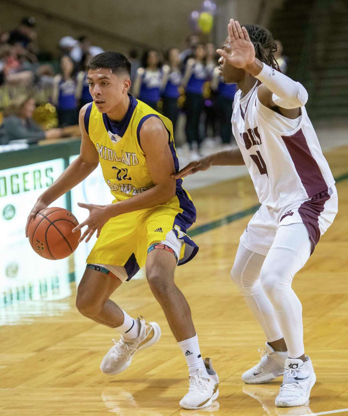 Midland High's Jaime Puentes dribbles the ball as Legacy High's Elijah Maxwell defends 02/01/2022 at the Chaparral Center. Tim Fischer/Reporter-Telegram