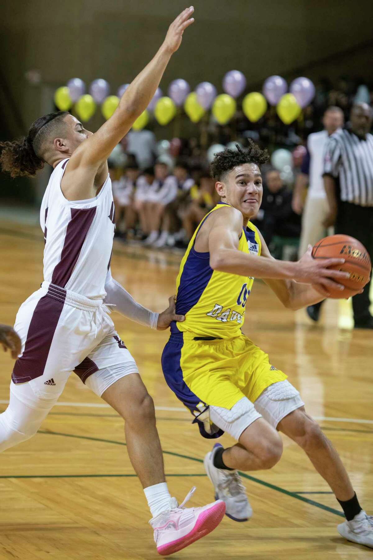 Midland High's London Rickett looks to drive to the basket as Legacy High's Donny Bishop defends 02/01/2022 at the Chaparral Center. Tim Fischer/Reporter-Telegram