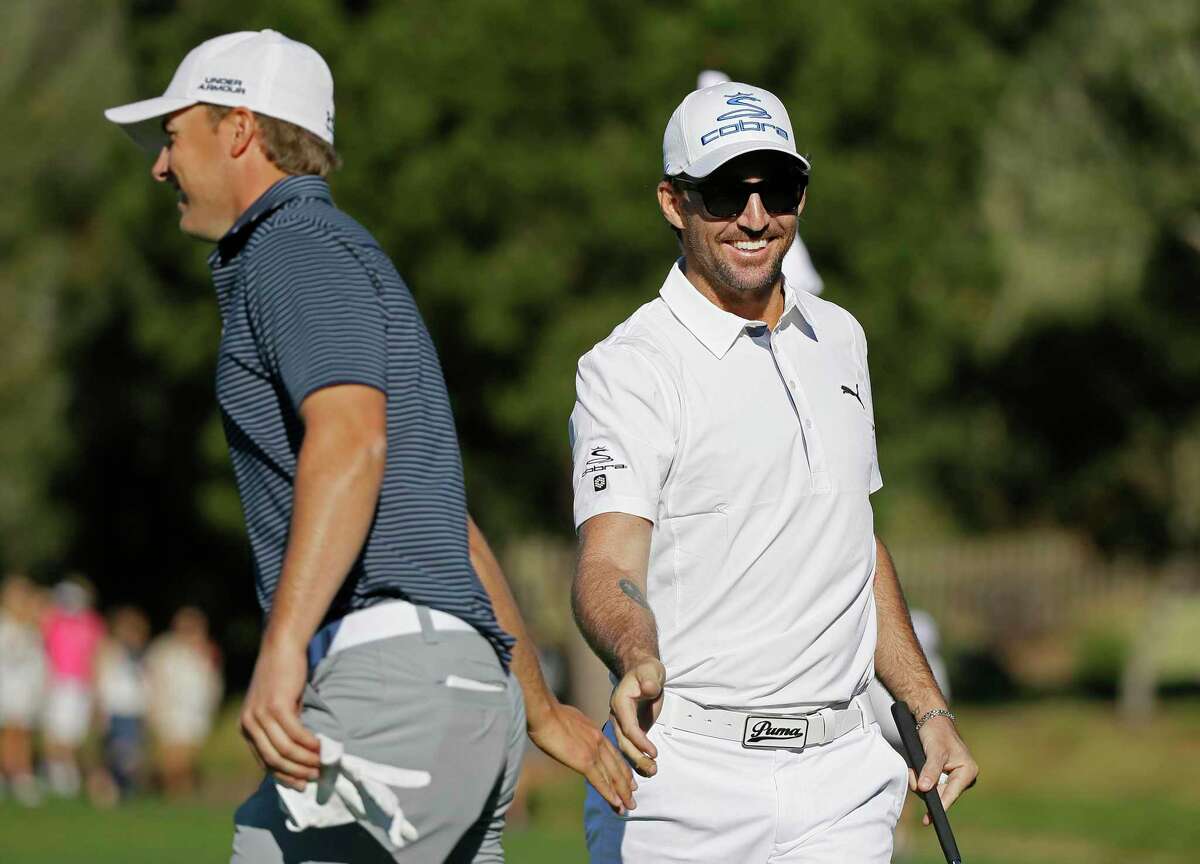 Country music singer Jake Owen (right) celebrates with playing partner Jordan Spieth after making an eagle during the third round of the 2015 AT&T Pro-Am at Pebble Beach.