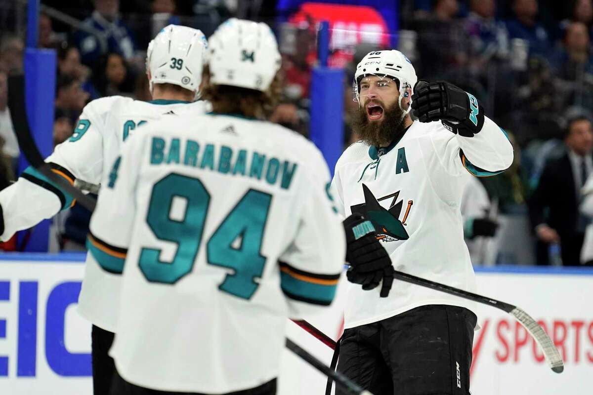 San Jose Sharks defenseman Brent Burns (88) celebrates a goal by Logan Couture during the third period of an NHL hockey game against the Tampa Bay Lightning Tuesday, Feb. 1, 2022, in Tampa, Fla. (AP Photo/Chris O'Meara)
