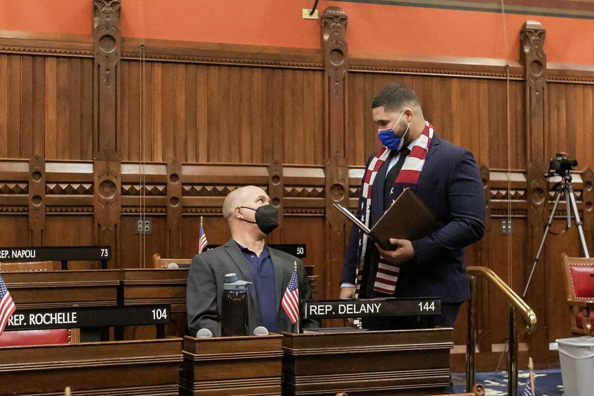 Democrat Hubert Delany, right, was sworn in Tuesday, Feb. 1, 2022 in Hartford as the new representative of the 144th state House District. Delany won a special election on Jan. 25, 2022.