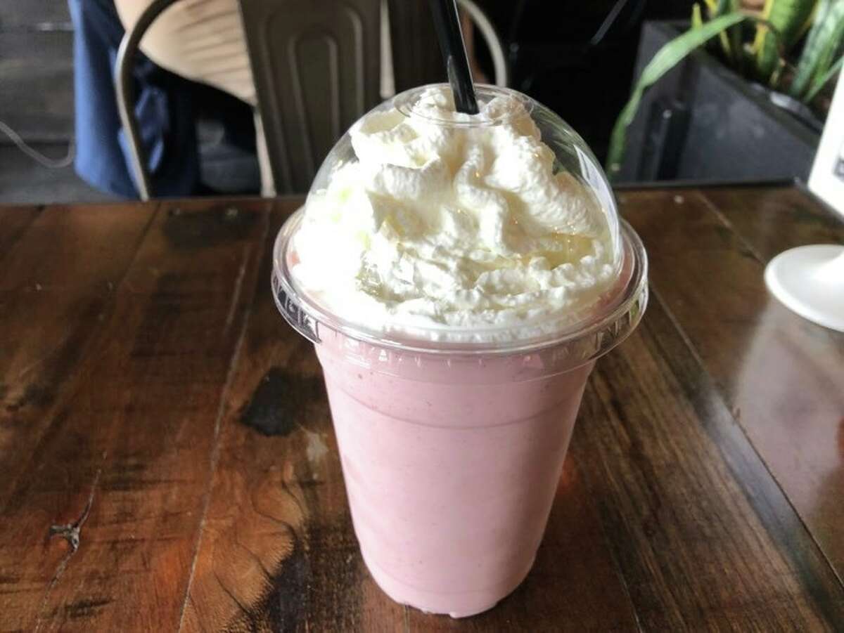 The strawberry banana smoothie at Live Oak Coffeehouse is thick, creamy, and will last a while. Whipped cream is not necessary, but highly reccomended.