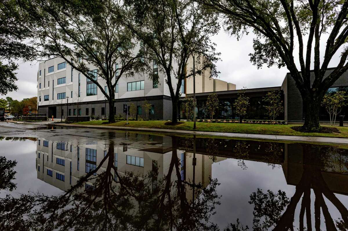 An exterior view of the John S. Dunn Behavioral Science Center is reflected in rain water on February 1, 2022 in Houston, TX.