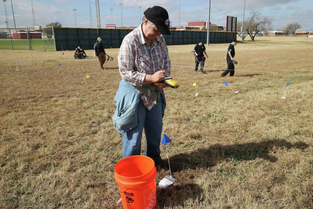 Peggy Wall, Project Archeologist with the Center for Archaeological Research at UTSA, documents finds at a site behind Losoya Middle School on Tuesday. American Veterans Archaeological Recovery Project staff and volunteers are conducting a dig in search of the Battle of Medina. The battle, which took place in August 1813 between the republican army and Spanish troops, resulted in the deaths of more than 1,000 people, making it the deadliest in Texas history.