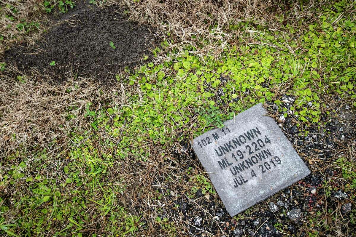 A grave marker where an unknown person is buried is shown in Harris County Eastgate Cemetery Wednesday, Feb. 2, 2022 in Crosby. There are a number of graves in county cemeteries with people who have died are buried and are never identified.