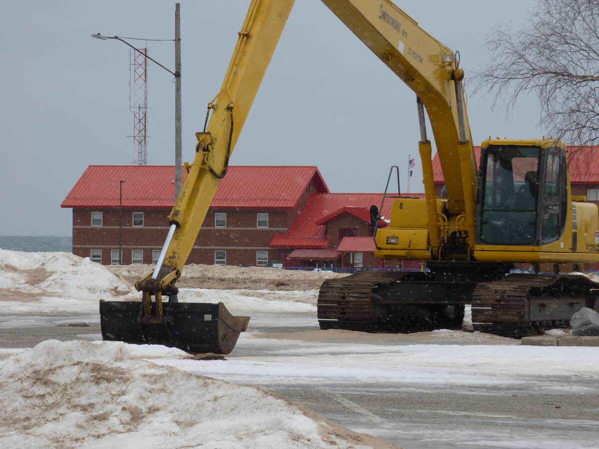 Equipment has been parked near First Street Beach in Manistee to begin waterfront work once the weather improves.