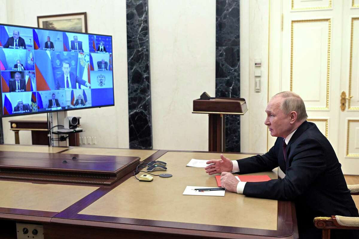 Russian President Vladimir Putin chairs a Security Council meeting via videoconference in Moscow, Russia, Wednesday, Feb. 2, 2022. (Alexei Nikolsky, Sputnik, Kremlin Pool Photo via AP)