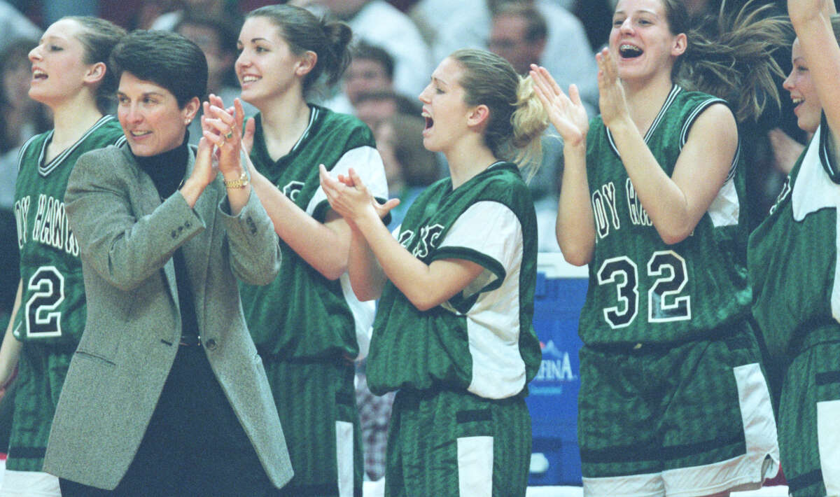 Head coach Lori Blade claps as a call goes Carrollton's way against University High at the state finals in Normal.