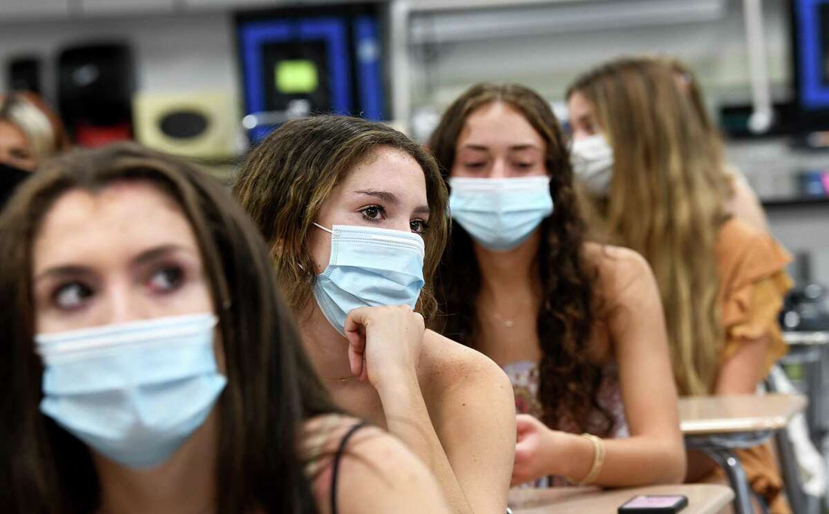 Seniors in Dr. Ryan Kelly’s homeroom wear masks on the first day of school at Fairfield Ludlowe High School in Fairfield, Ct., Monday morning, August 30, 2021.