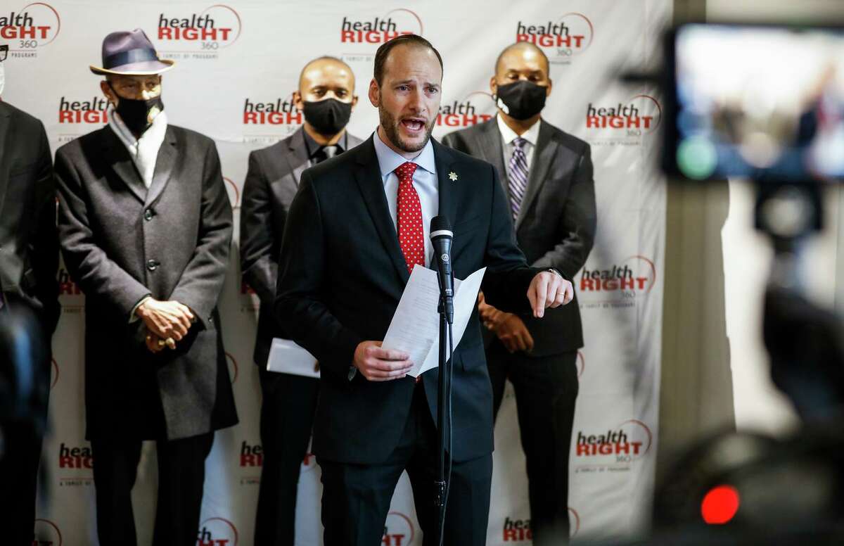 San Francisco District Attorney Chesa Boudin (center) struck a deal with the San Francisco Police Department in 2019 amid controversy over how police shootings are investigated.