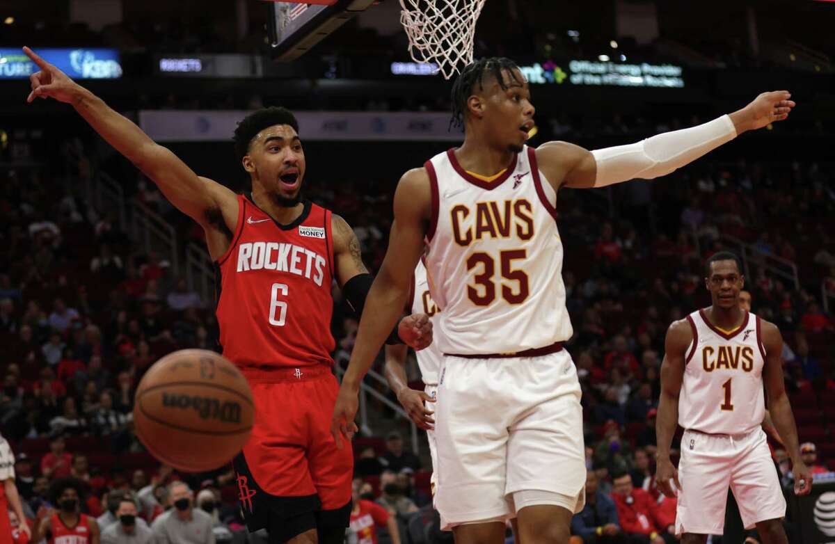 Houston Rockets forward Kenyon Martin Jr. (6) and Cleveland Cavaliers forward Isaac Okoro (35) each tries to call foul during the first half of the game at the Toyota Center, Wednesday, Feb. 2, 2022, in Houston.
