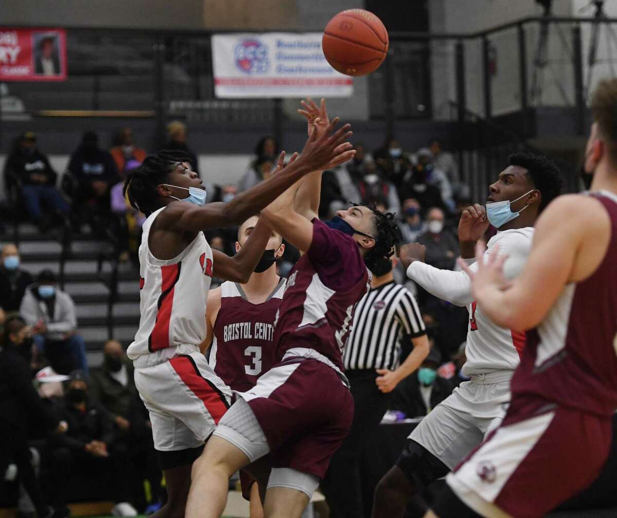 Wilbur Cross' Elijah Jean-Guillaume battles for a loose ball with Bristol Central's Steven Alseph during the first half of their game at the Robert Saulsbury Basketball Invitational tournament at the Floyd Little Athletic Center in New Haven, Conn. on Saturday, February 2, 2022.