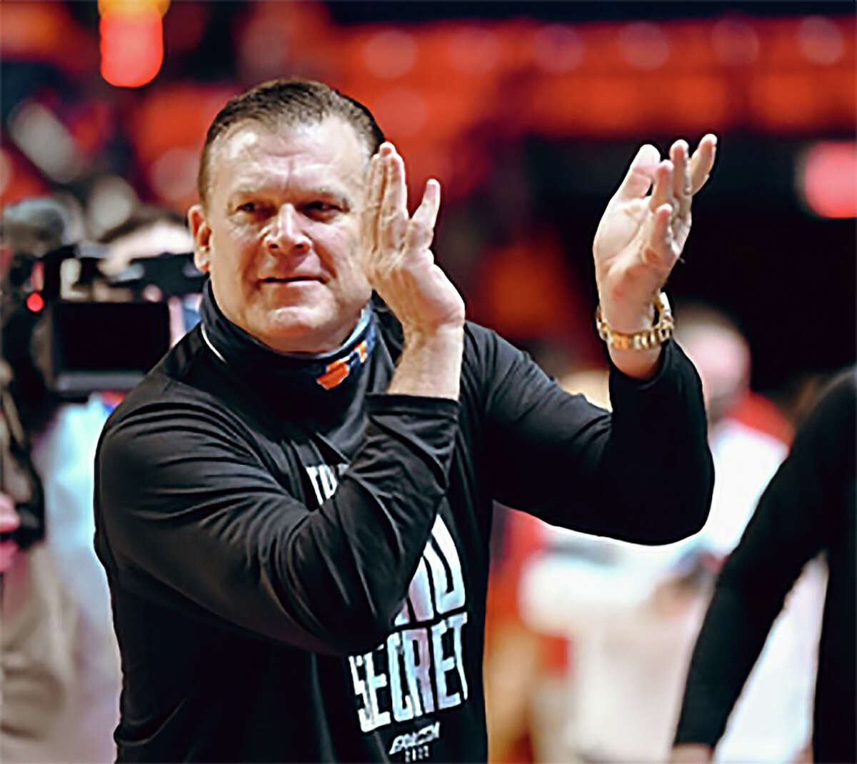 Illinois coach Brad Underwood claps during his team's 80-67 win over Wisconsin Wednesday night in Champaign.