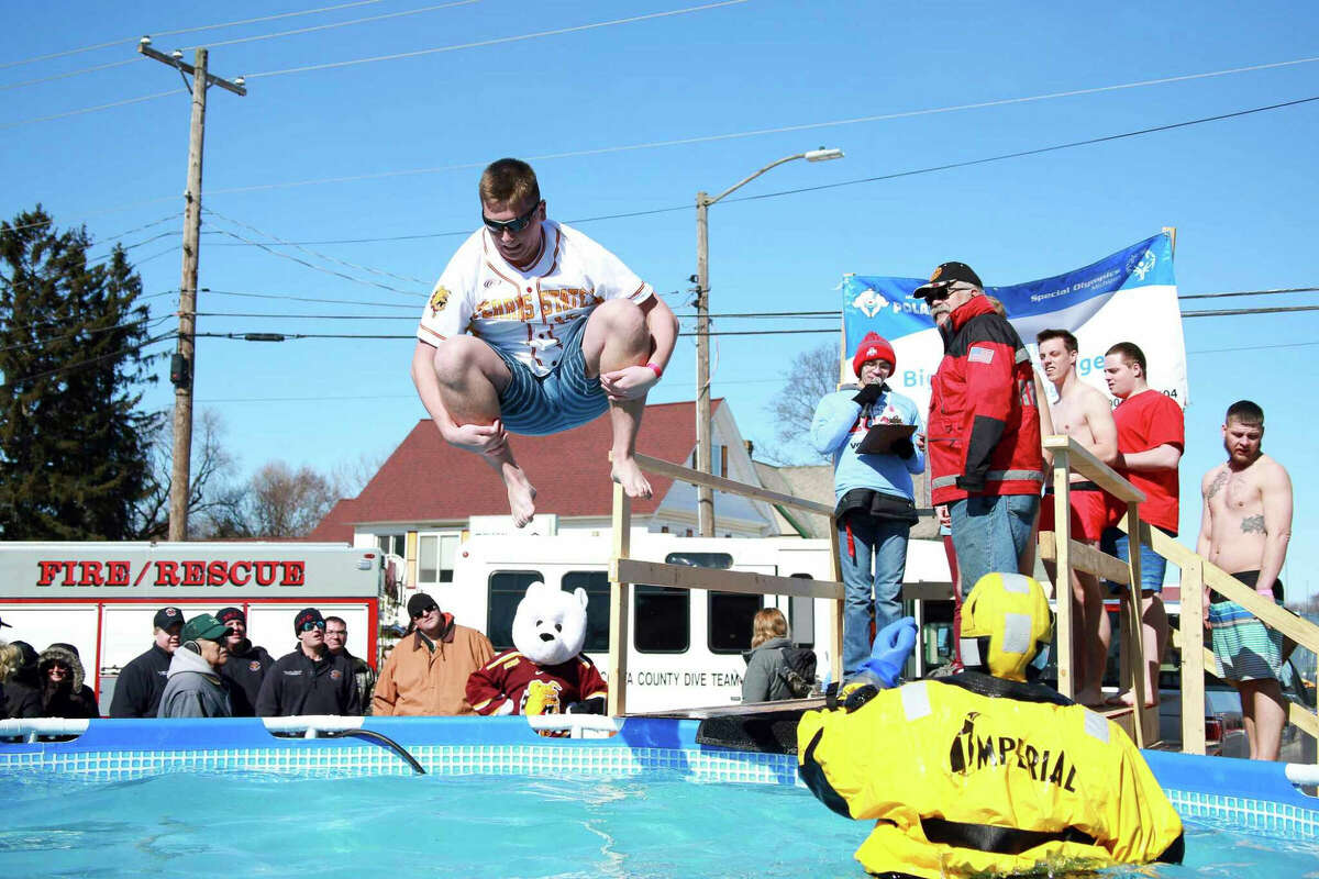 In this March 2020 Pioneer file photo, plungers take a chilly dip during the annual Polar Plunge. All of the monies raised benefits Special Olympics. 