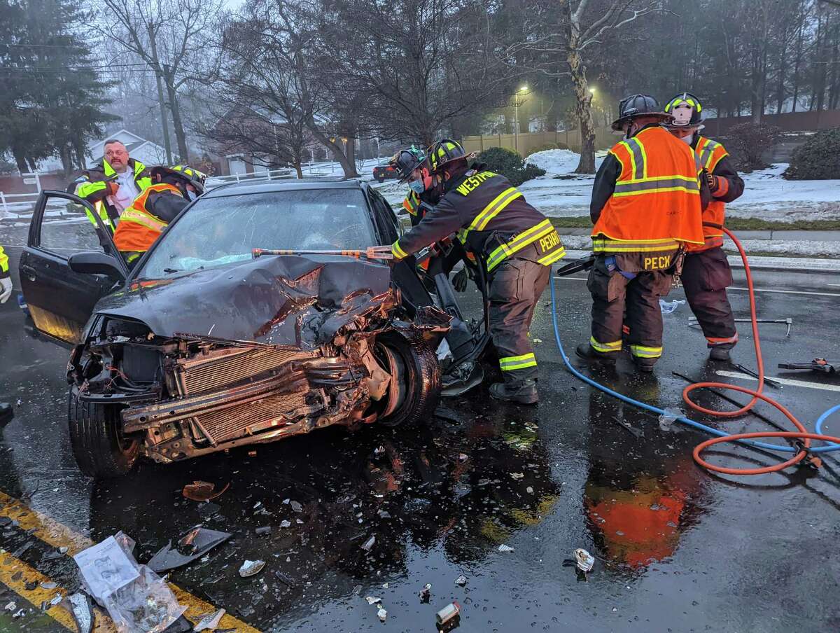 Westport fire fighters responded to a crash on the westbound side of the Post Road on Thursday, Feb. 3, 2022. Officials said two people were taken to the hospital, and one driver had to be extricated from their vehicle.