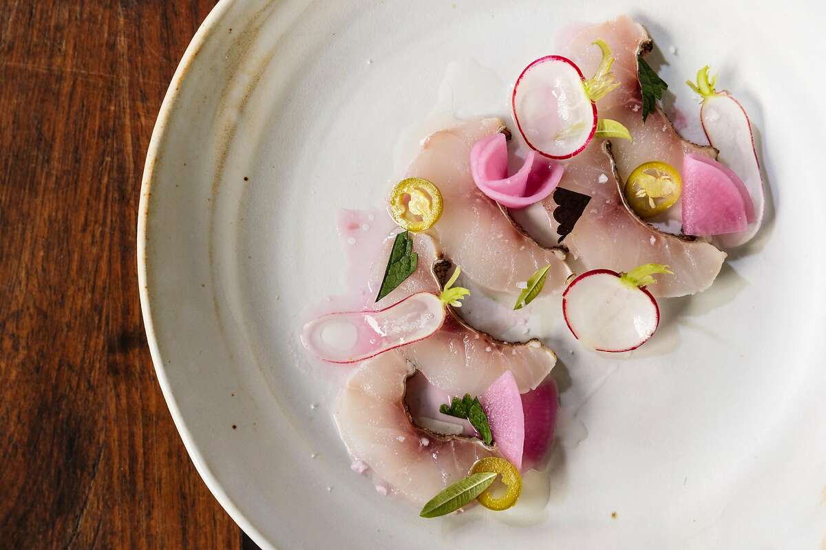 Bodega dried rockfish, fermented radish, chili peppers, lemon verbena and lime at Pomet's Restaurant in Oakland.