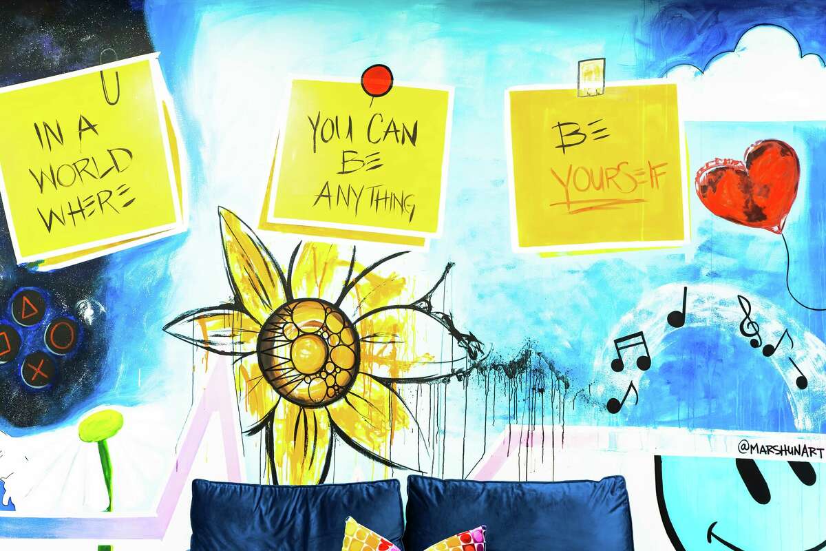 Local artist Candyce John, also known as "Marsh," volunteered his time to paint the teenage room of the New Haven Department of Child and Family Services.  These post-it notes are intended to remind children to never imitate others and to always be themselves.