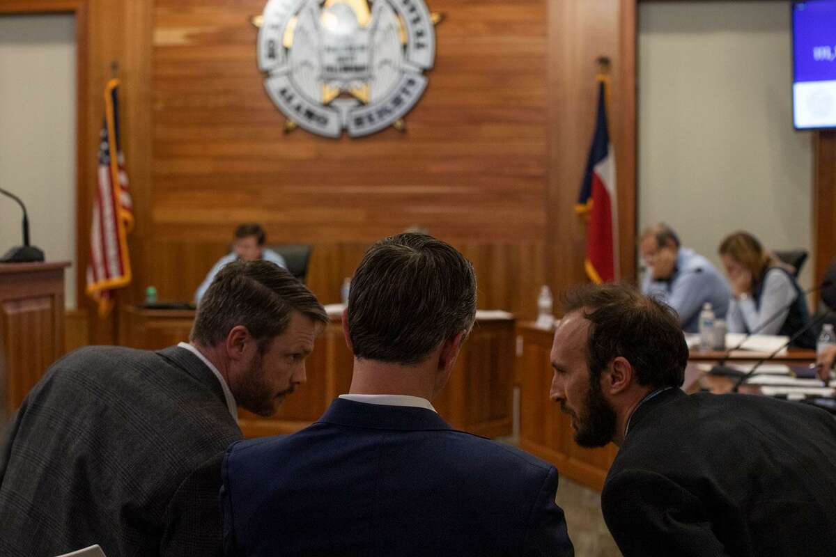 Ridgemont Properties Vice President C. Trebes Sasser Jr. consults with Attorney James Griffin and CREO Design Principal Kris Feldman on Wednesday at the Alamo Heights City Council Chambers. (Kaylee Greenlee Beal for the San Antonio Express-News)
