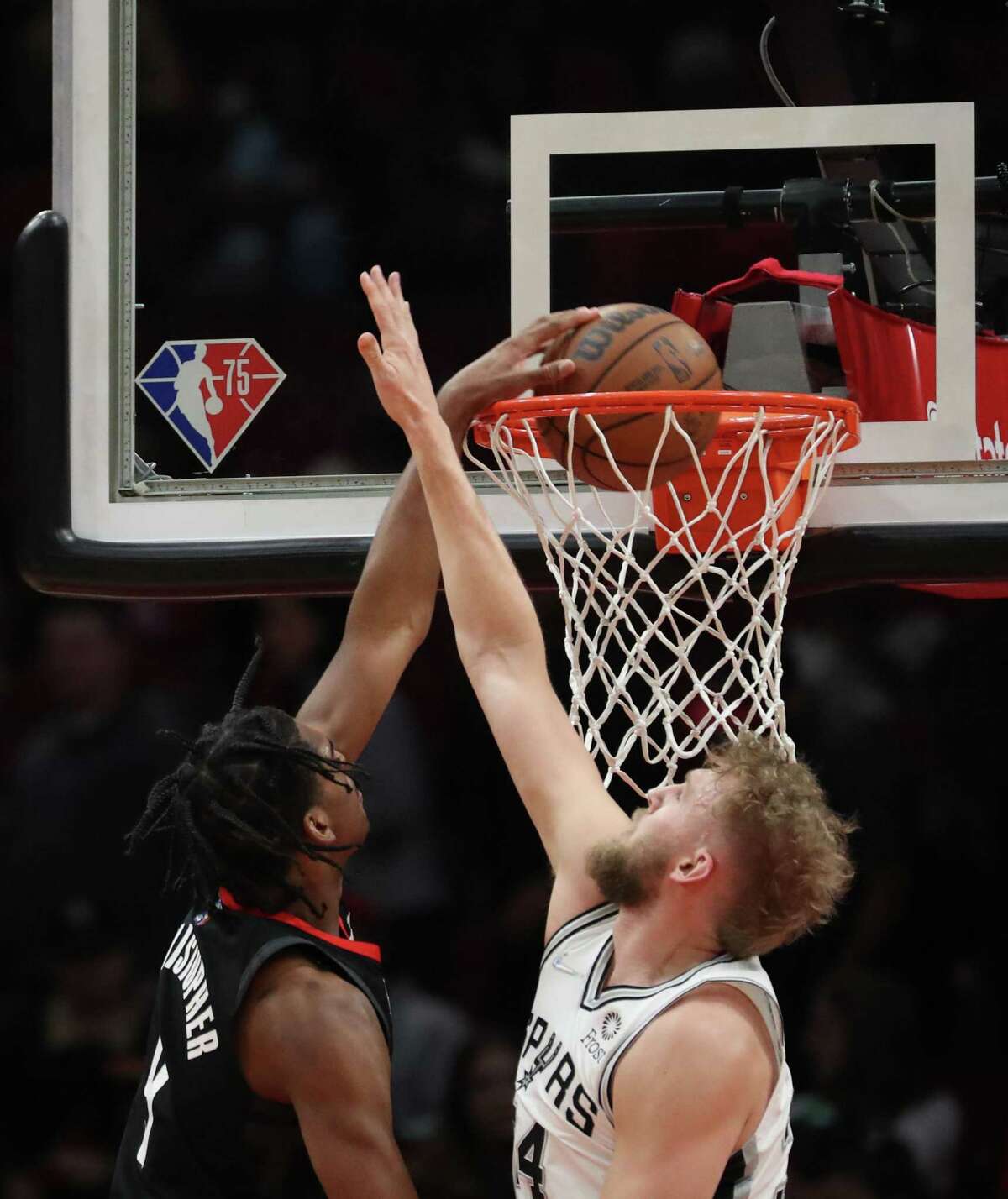 Houston Rockets guard Josh Christopher (9) dunks over San Antonio Spurs center Jock Landale (34) during the fourth quarter of an NBA game Tuesday, Jan. 25, 2022, at the Toyota Center in Houston.