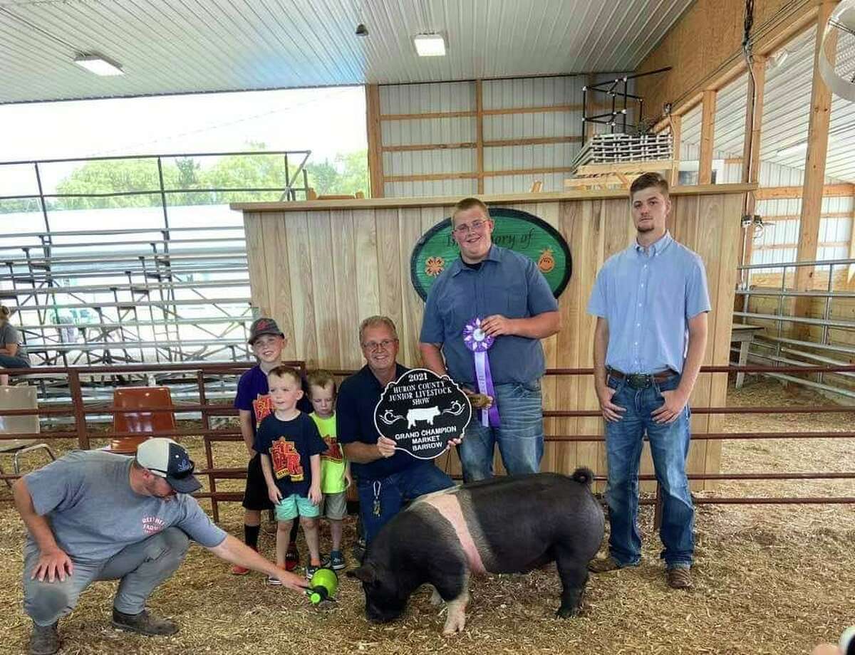 The FFA stands with award-winning pig.