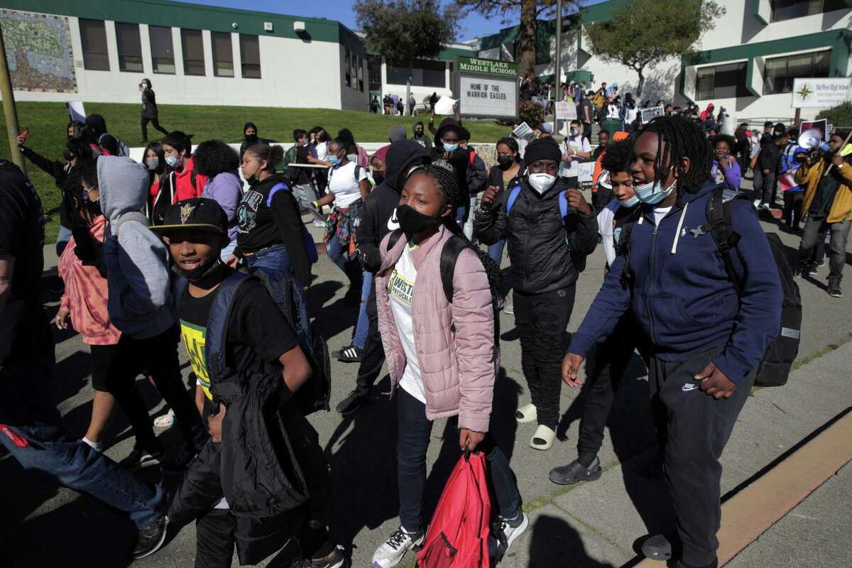 Students walk out of Westlake Middle School on Tuesday to protest its consideration for closure by the Oakland Unified School District.