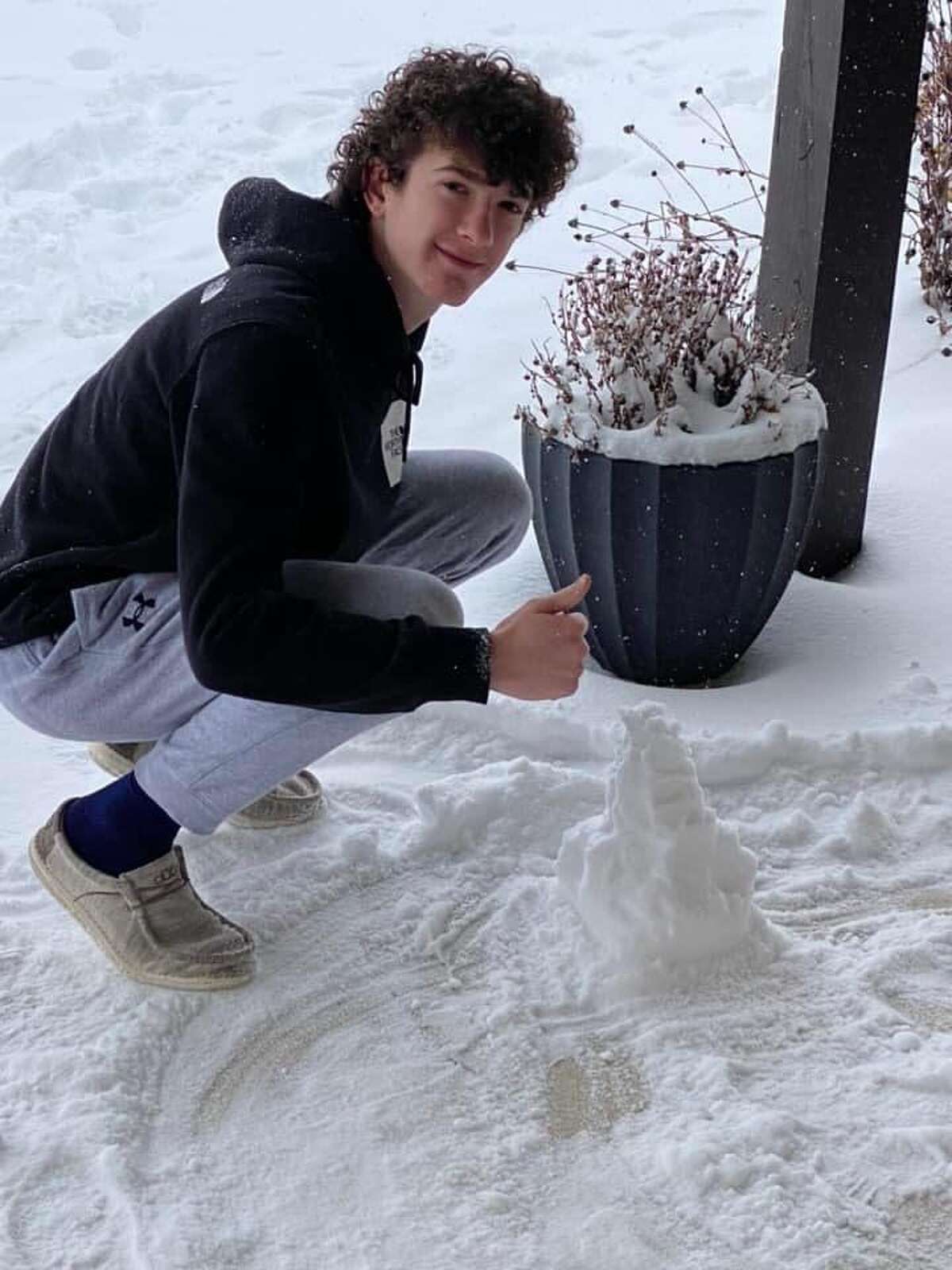 Ryker Keller, Class of 2024, building a snowman for his Honors Chemistry class. 