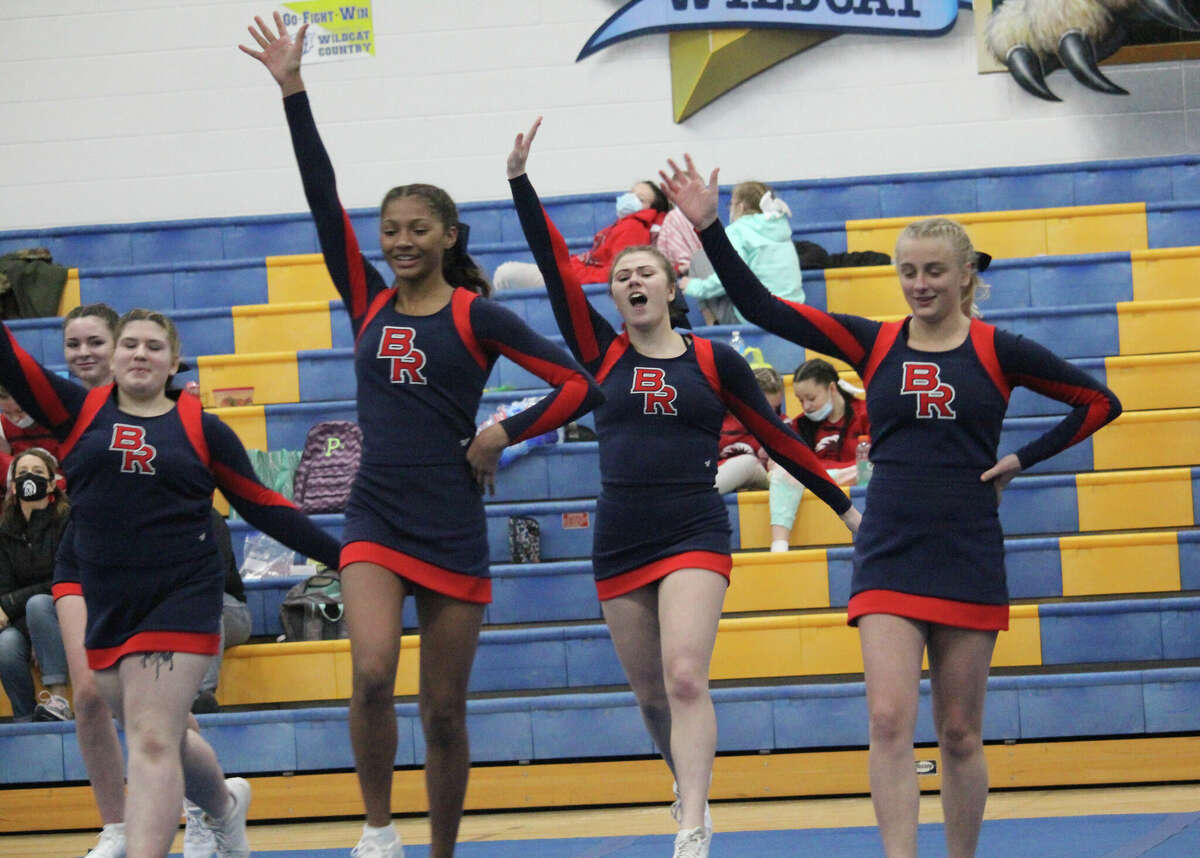 Big Rapids cheerleaders get ready to peform in round 3 at the Evart Invitational on Saturday.