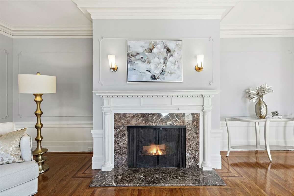 A fireplace warms the living room.