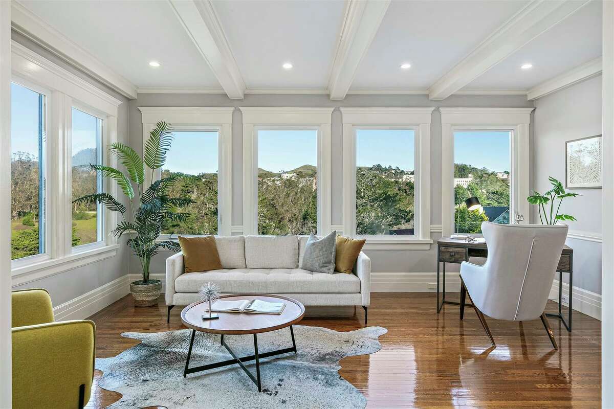 A drawing room/office off the primary suite overlooks surrounding hills and forest.