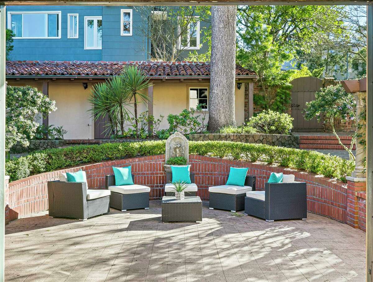 A unique nook for outdoor living is created by the property's perimeter brick work. 