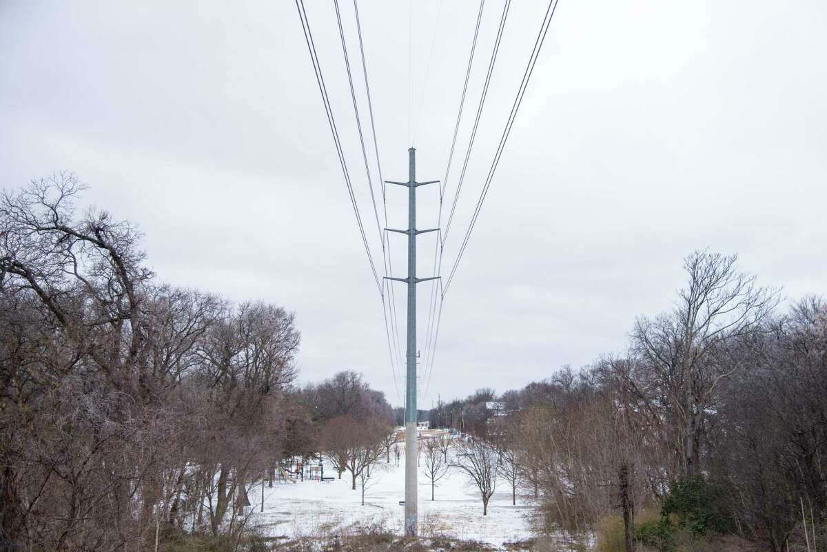 Snow lies on the ground near power lines at White Rock Lake after a winter storm on February 3, 2022 in Dallas, Texas. A major winter storm pummeled areas from the South to the Midwest with snow, sleet, and freezing rain as it continues to move east across the United States.