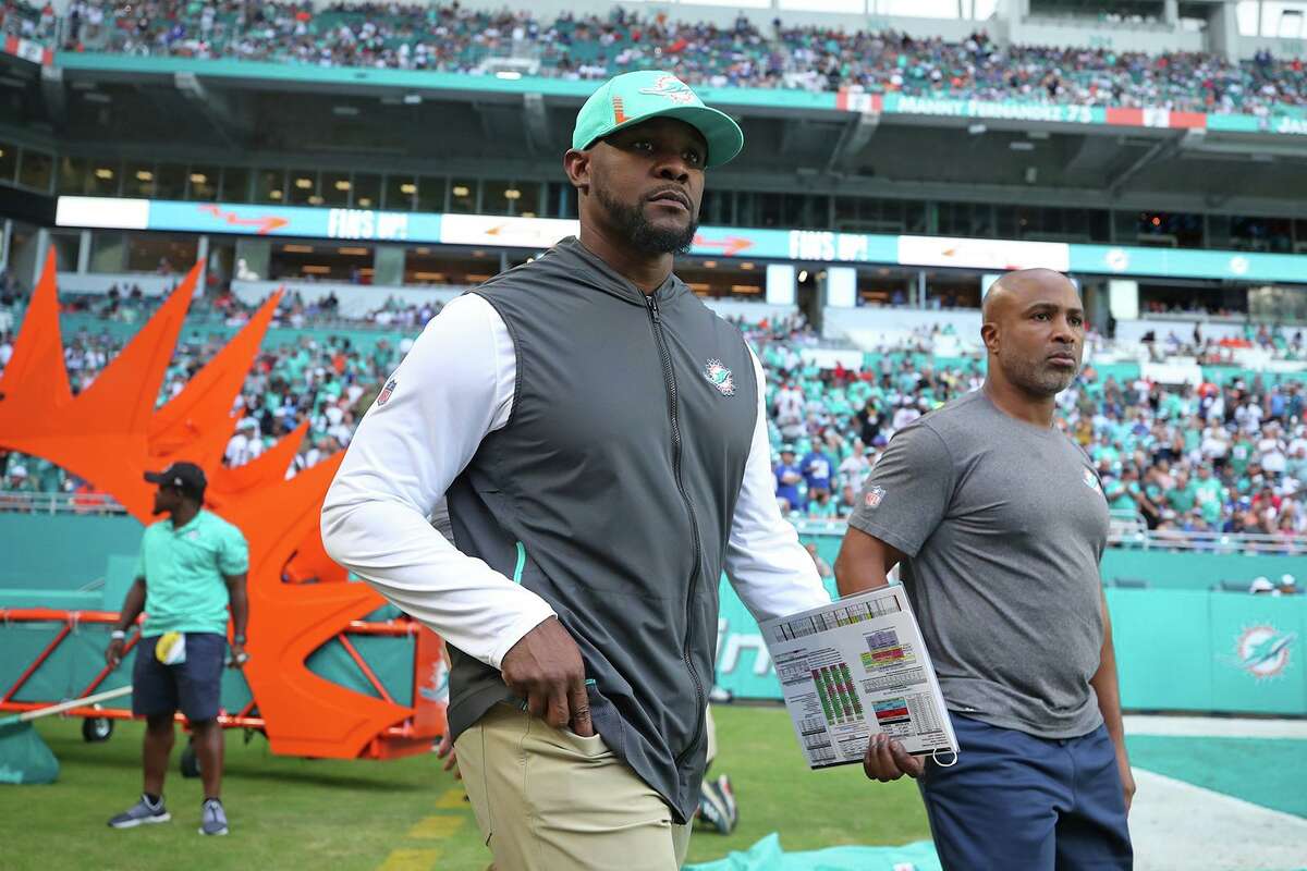 Former Miami Dolphins coach Brian Flores takes the field for Miami's game against the New York Giants on Dec. 5, 2021.