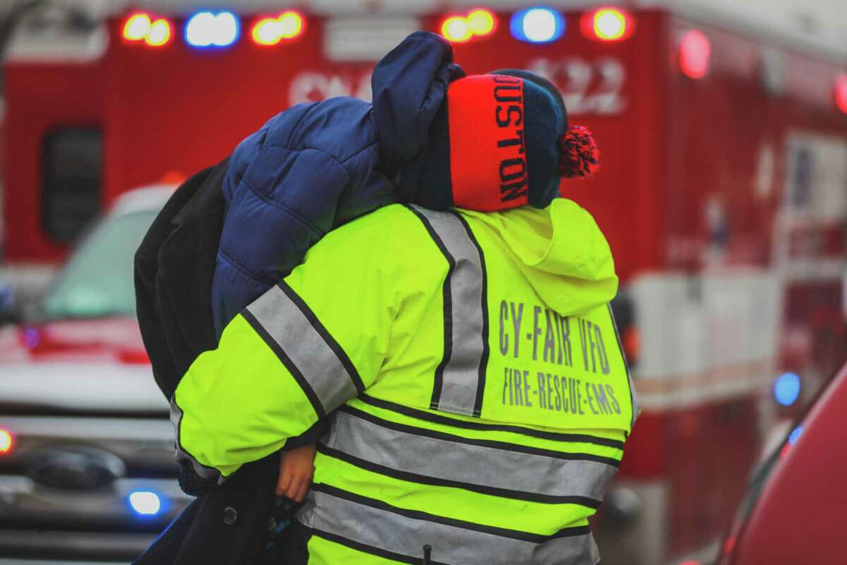 Crews with the Cy-Fair Fire Department help people who need medical attention for carbon monoxide poisoning during the winter storm Tuesday, Feb. 16, 2021.
