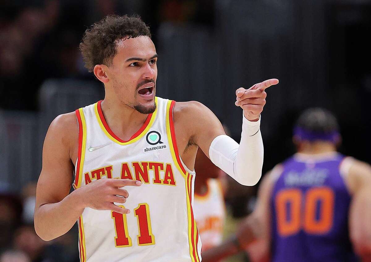ATLANTA, GEORGIA - FEBRUARY 03: Trae Young #11 of the Atlanta Hawks reacts after hitting a three-point basket against the Phoenix Suns during the second half at State Farm Arena on February 03, 2022 in Atlanta, Georgia. NOTE TO USER: User expressly acknowledges and agrees that, by downloading and or using this photograph, User is consenting to the terms and conditions of the Getty Images License Agreement. (Photo by Kevin C. Cox/Getty Images)