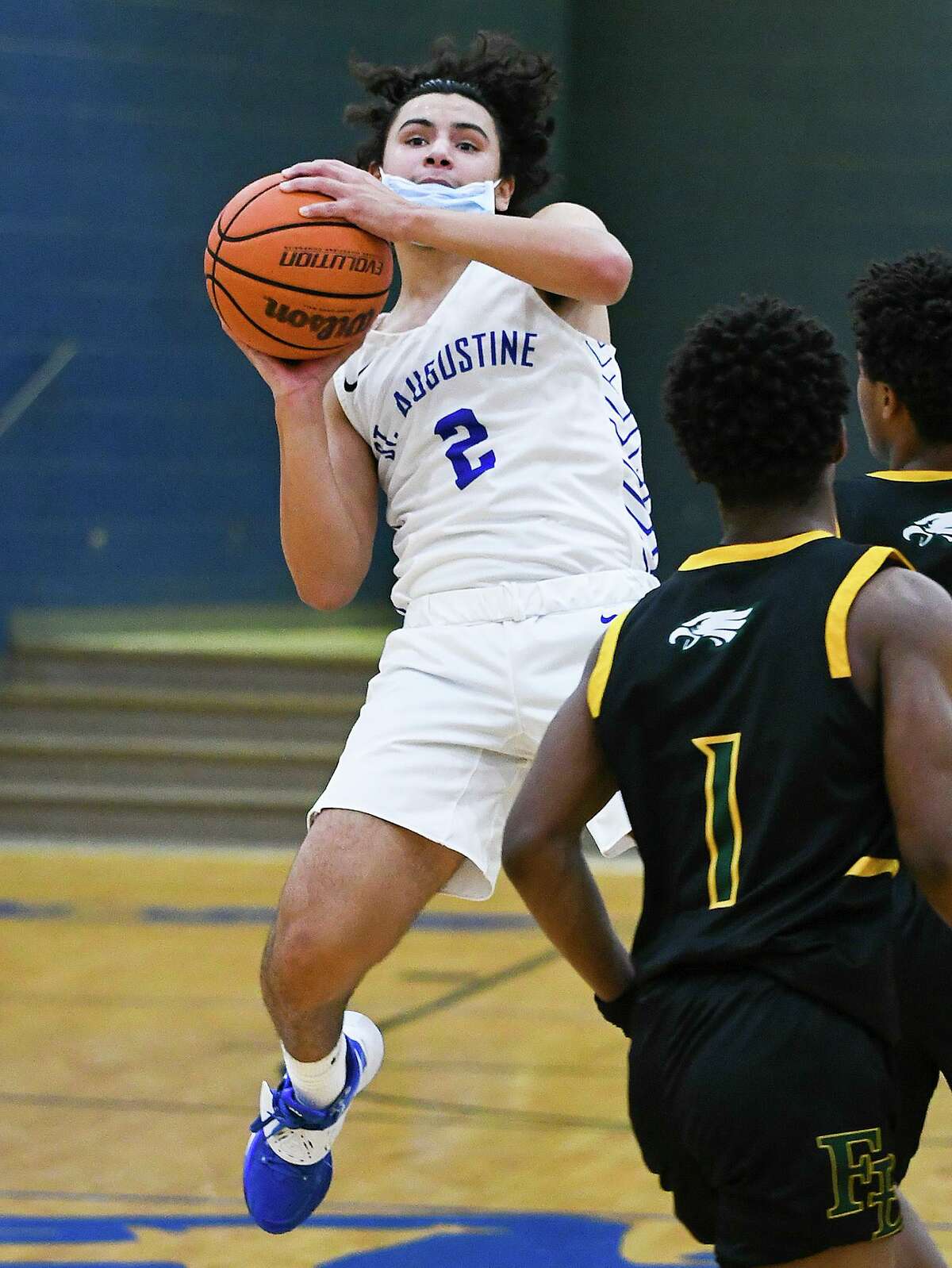 In this file photo, St. Augustine High School’s Diego Romo takes a last-second shot during a game against Fort Bend Christian Academy, Saturday, Feb. 27, 2021, at St. Augustine High School.