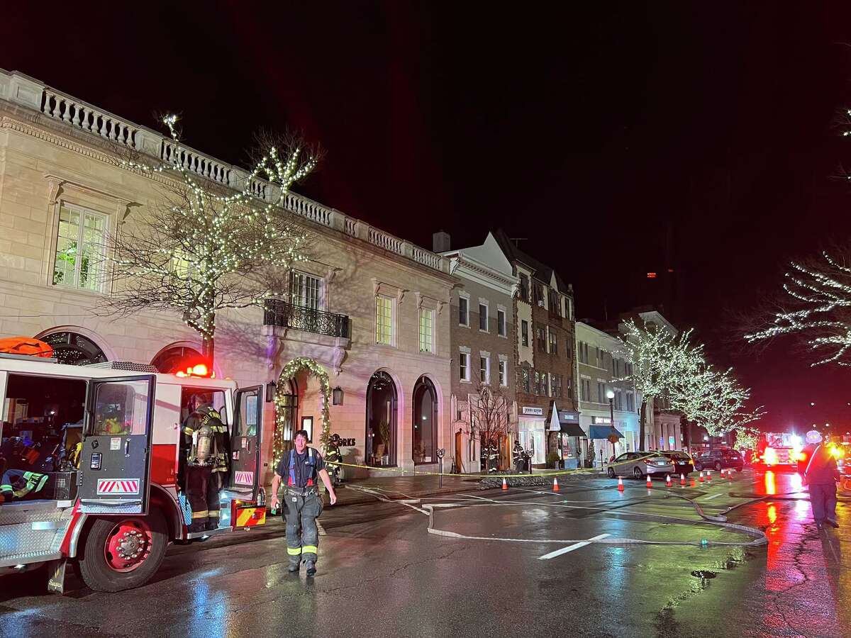 Firefighters respond to an underground cable fire on Greenwich Avenue on Thursday night.