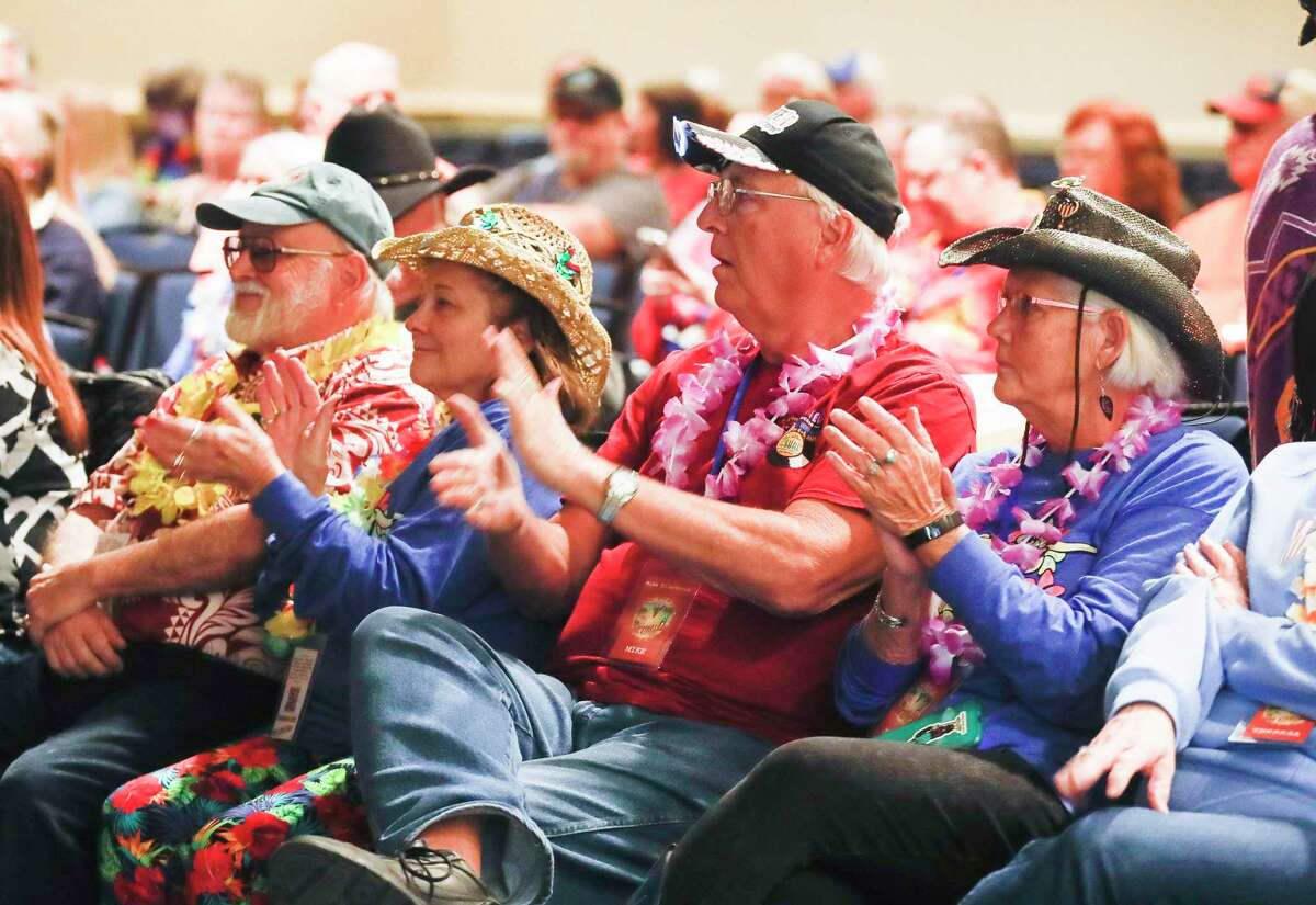 Visitors clap along with Trop Rock musicians as they perform during the annual Lone Star Luau at Margaritaville Lake Resort, Friday, Feb. 4, 2022, in Montgomery. Approximately 600 people are expected to take part in the four-day music festival that includes a pub crawl at the resort, vendors and eighteen live bands.