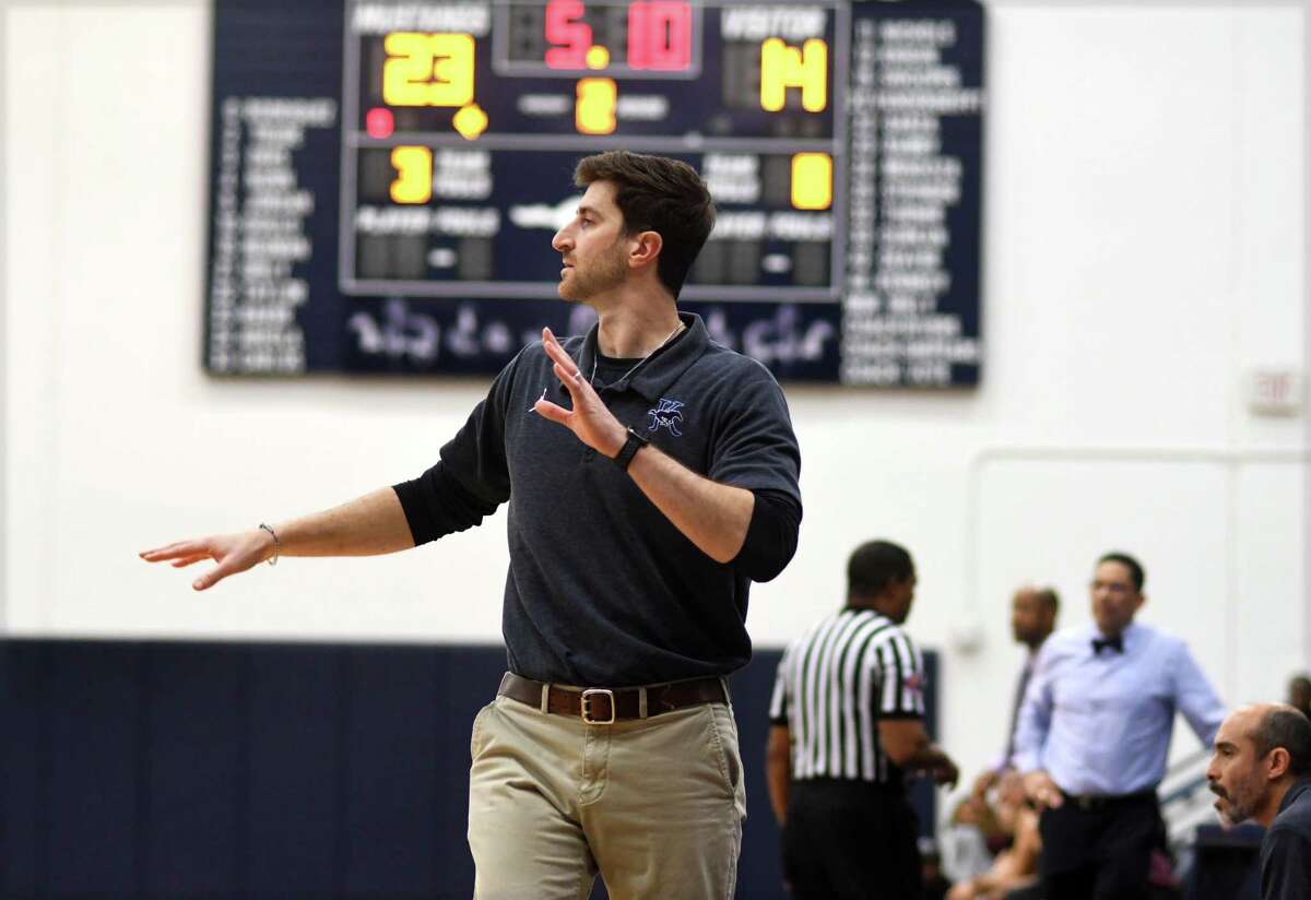 Kingwood head coach Monte Cole leads his team against Summer Creek during the second quarter of their District 21-6A matchup at Kingwood High School on Friday, Jan. 14, 2022.