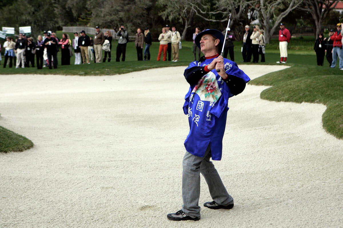 Actor Bill Murray hits from the bunker during the AT&T Pebble Beach Pro-Am Golf Tournament Celebrity Challenge Event at Pebble Beach Golf Links in Pebble Beach, Calif. on Wednesday, Feb. 11, 2009. (AP Photo/ Marcio Jose Sanchez)