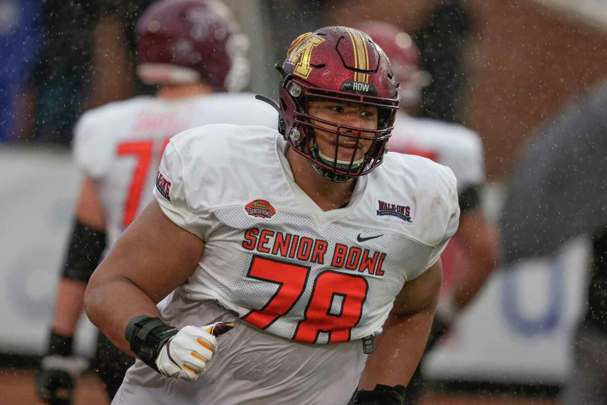 National Team offensive lineman Daniel Faalele of Minnesota runs through drills during practice for the Senior Bowl NCAA college football game Wednesday, Feb. 2, 2022, in Mobile, Ala.