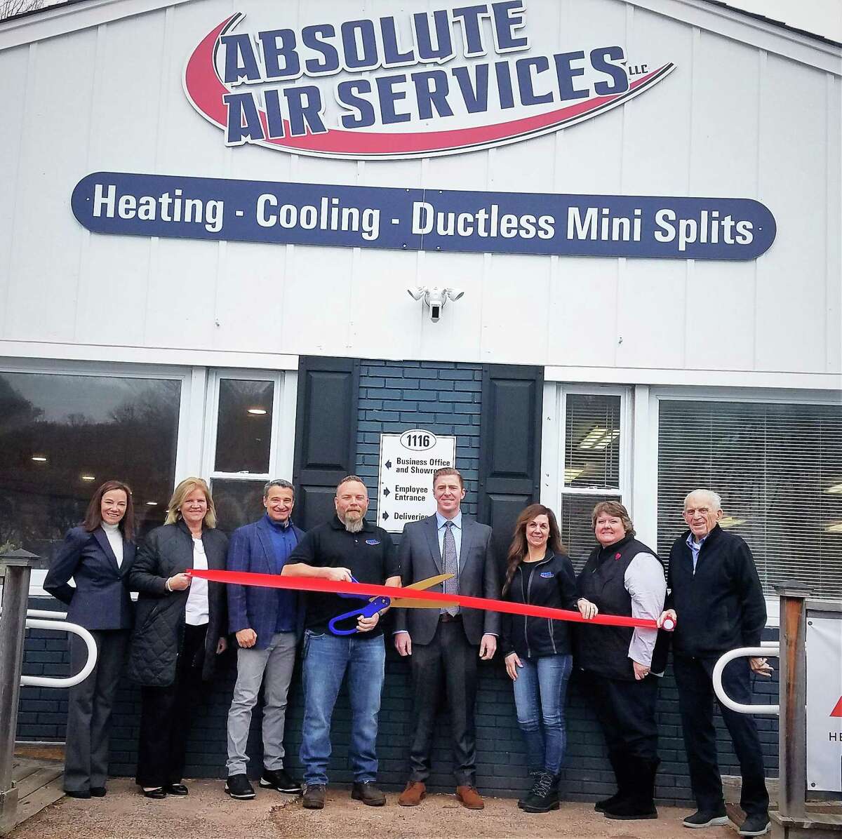 Absolute Air Services in Portland held a grand opening for its new showroom Wednesday. From left are Middlesex County Chamber of Commerce Vice President Johanna Bond, state Rep. Irene Haines, Economic Development Commission Chairman Mike Nadolski, owner Steve Graff, First Selectman Ryan Curley, owner Bonnie Graff, chamber East Hampton Division Chairwoman Catherine Egan and Chamber President Larry McHugh.