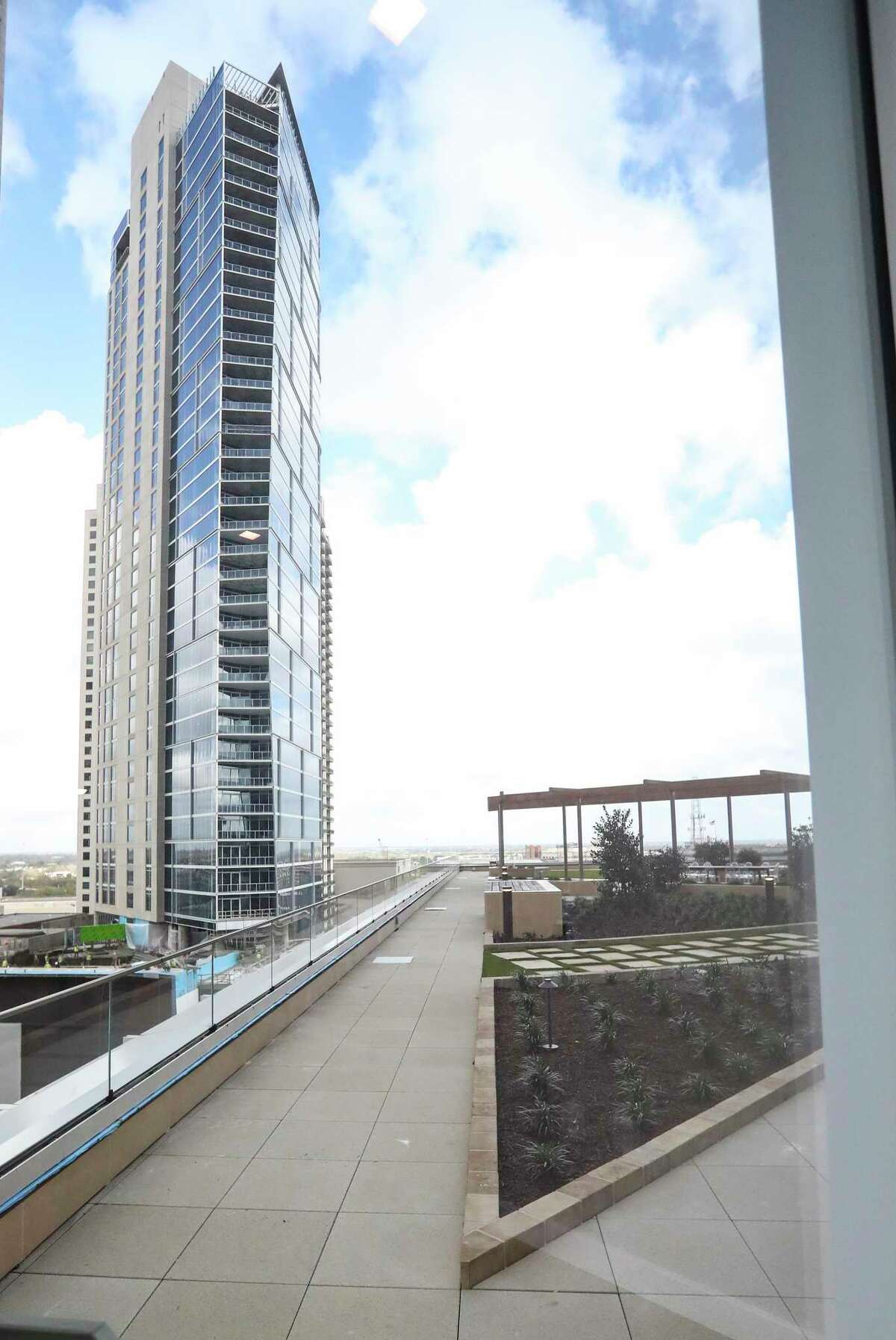 The 12th floor terrace of the downtown Texas Tower has a view of Brava, a new 46-story apartment on the site of the former Houston Chronicle garage. This very modern building is nearing completion, expected to open to the public in early March.