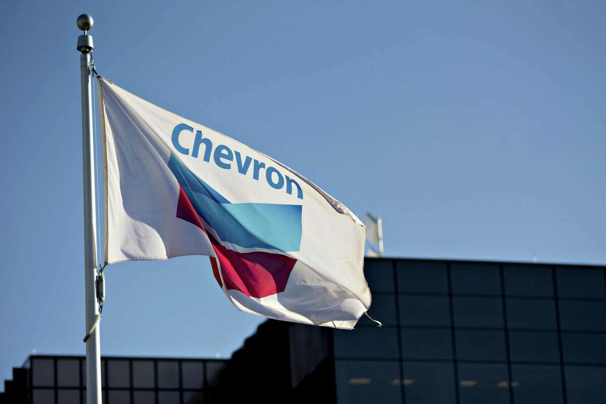 A Chevron flag flies outside an office building in Midland in the heart of the Permian Basin. The company grew oil production in the Permian by 15 percent in Q2 of 2022. 