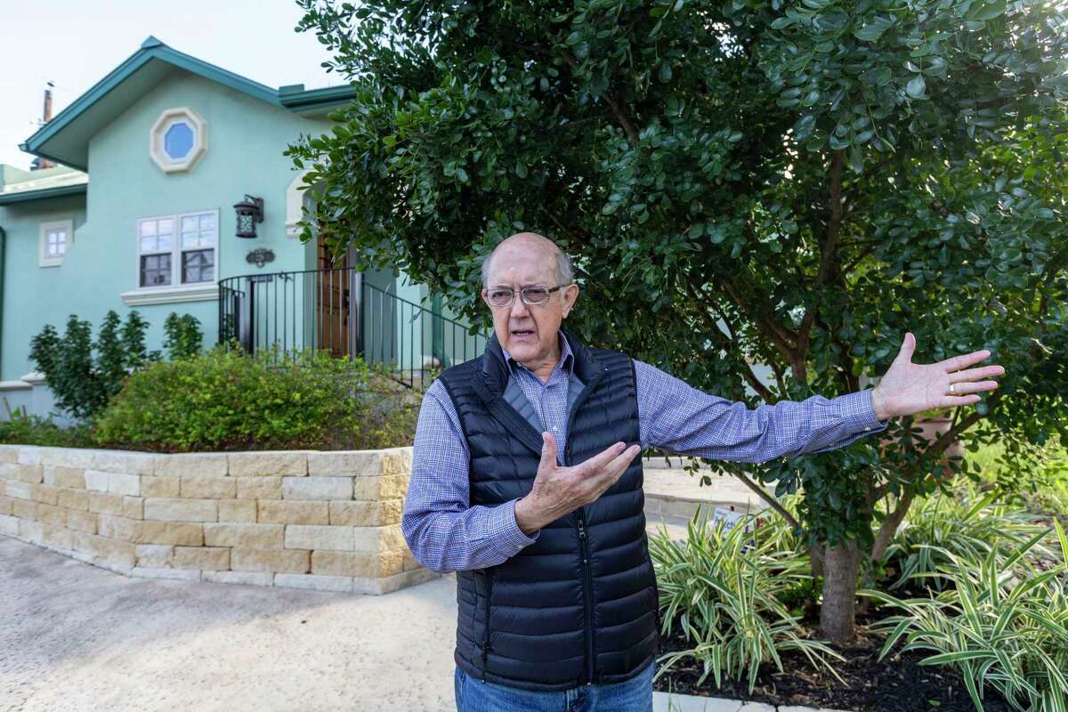 Homeowner Jim White talks Jan. 10 about problems with drainage in and around his Annie Street home that occur when San Antonio gets heavy rains.