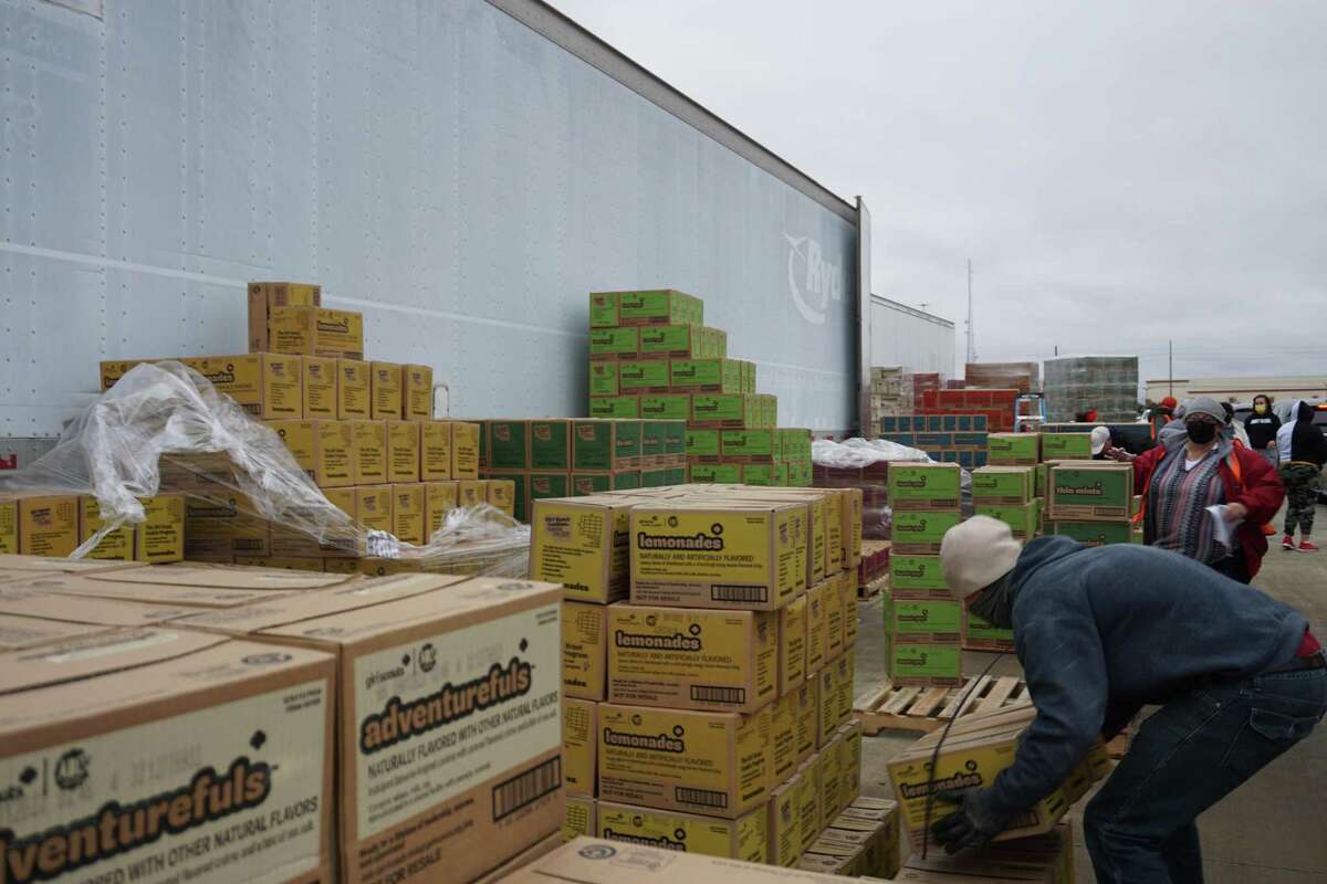 Pallets of cookies wait to be loaded onto vehicles at a Girl Scout Cookie Drop on Thursday, Feb. 3, at Legacy Stadium in Katy.