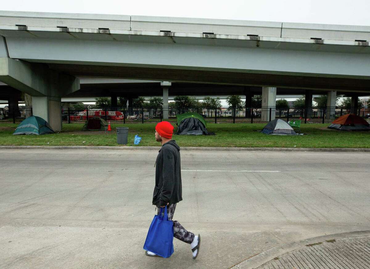 One of the city’s homeless encampments is located under U.S. 59 near Minute Maid Park. A homeless man was found dead during the freeze on the North Hamilton Street, pictured.